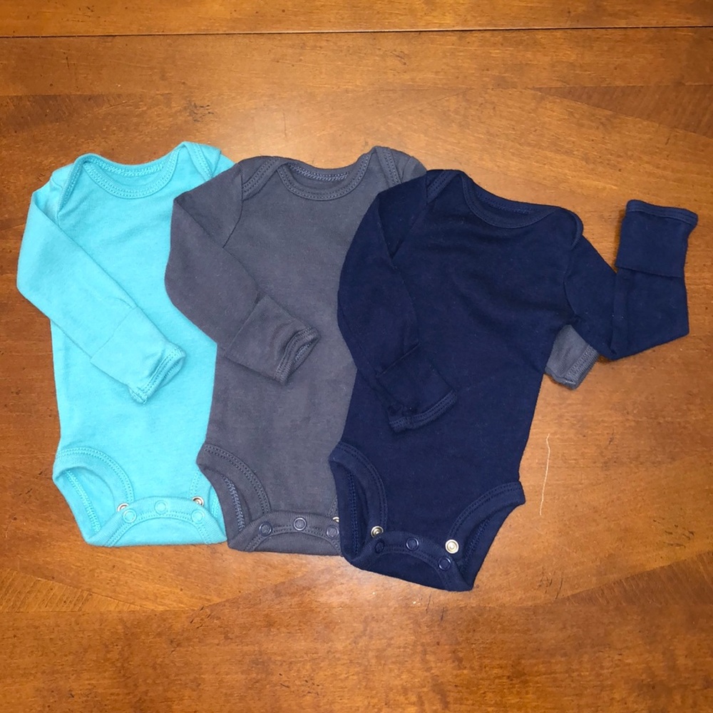 Preemie onesies with built in mits.